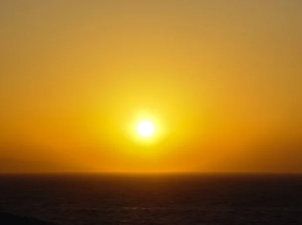 La puesta de sol en la isla de Mykonos en Grecia — Foto de Stock