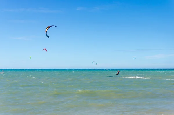 Cumbuco white sand beach with many kitesurfers