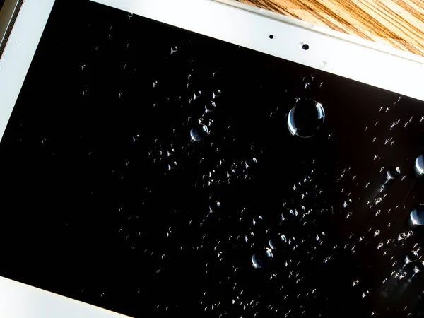 Water spilled onto the tablet