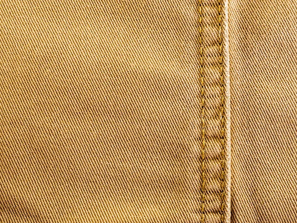 Текстура и шов джинсовой ткани — стоковое фото