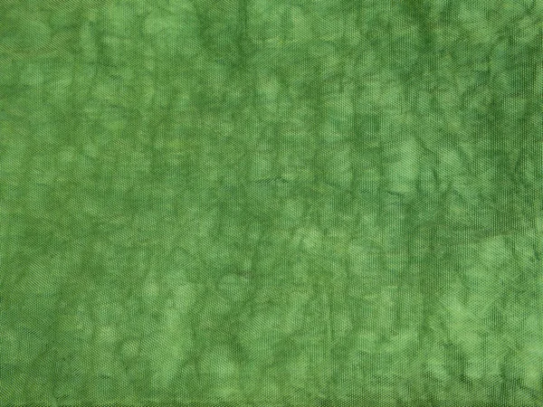 Oppervlaktetextuur van groene kleur en verfrommeld canvas stof — Stockfoto