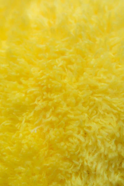 Žlutá kožešiny textury povrchu tkaniny — Stock fotografie
