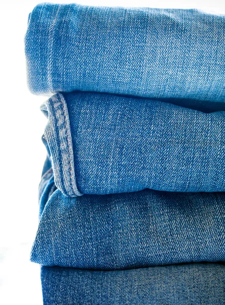 Högen av blå jeans, tyg textur — Stockfoto