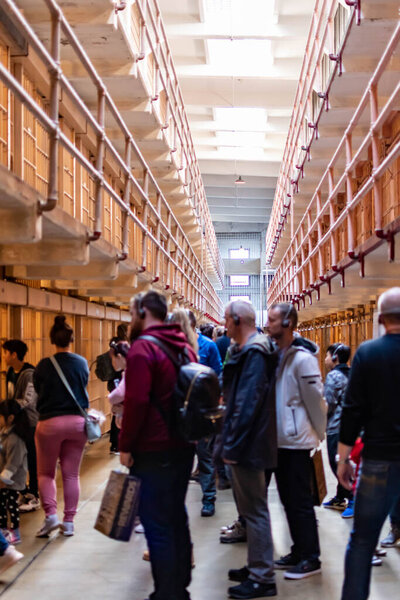 Alcatraz Prison B Block Prisoners cell area and some tourist and visitors inside the cellhouse building, San Francisco California USA, March 30, 2020