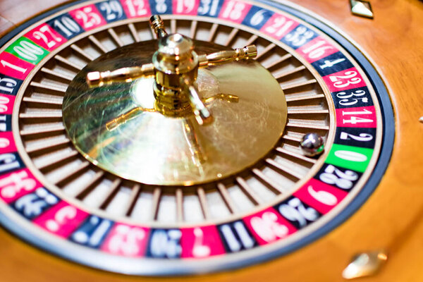 Casino theme. image of casino roulette, poker game. the drum from roulette. that our life-game. Luxury roulette in a casino. roulette wheel and the ball in the winning number zero. close up image