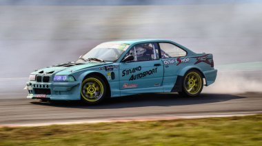 Oschersleben, Germany, August 31, 2019: Alexandre Strano driving a BMW E36 M3 Turbo by Strano Autosport during the Drift Kings International Series at Motorsport Arena. clipart