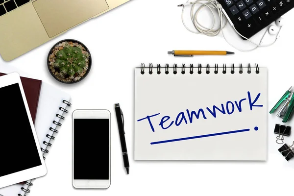 Teamwork on notepad - White office desk with smartphone with bla — Stock Photo, Image