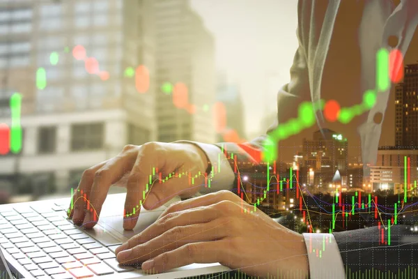 Double exposure of businessman using the laptop with cityscape a — Stock Photo, Image