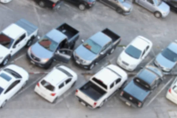 Niewyraźne odkryty parking pełne samochodów: dla transportu ba — Zdjęcie stockowe