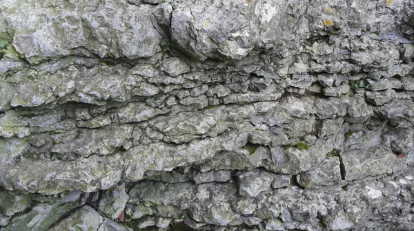 Antiguo muro de piedra, mampostería natural — Foto de Stock
