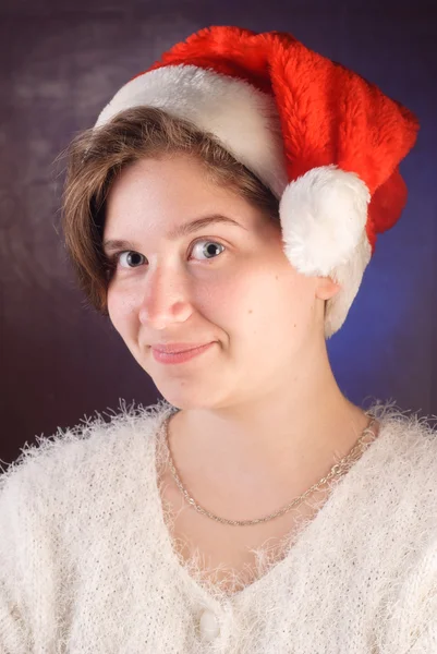 Funny young girl in red Santa hat, — Stock Photo, Image