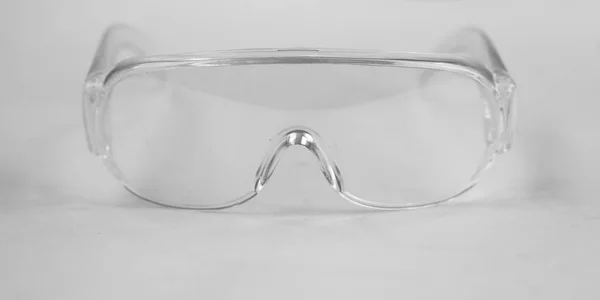 photo white protective spectacles on white background,