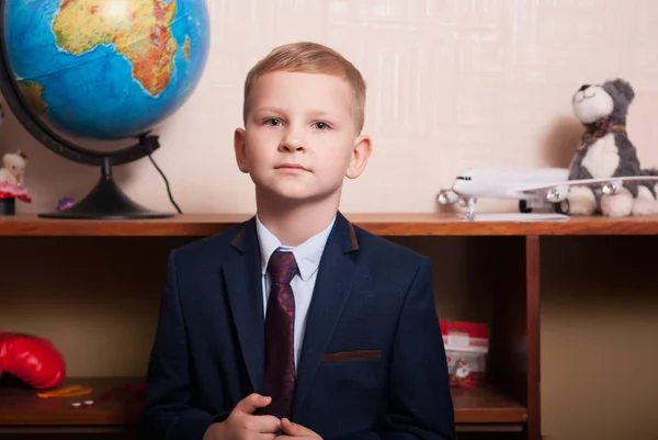 Young blonde boy businessman dressed in a suit and tie, — Stock Photo, Image