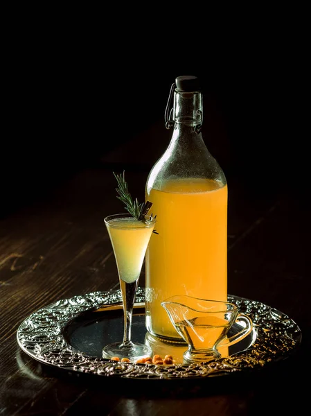 Home-made alcoholic tincture on sea-buckthorn — Stock Photo, Image