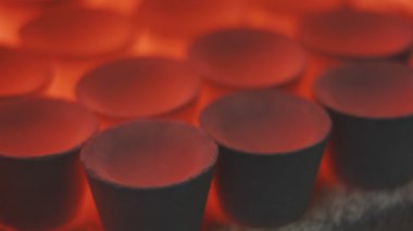 Jewelry molds are heated in a blast furnace blast at a jewelry production