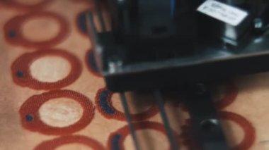 Machine is automatically drawing a jewelry a sketch for a new ring at a jewelry production
