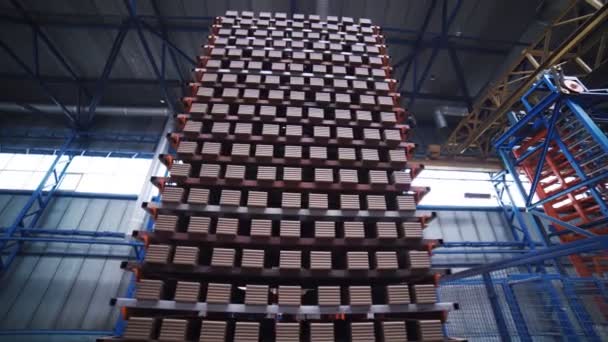 Stacks of grey bricks on a loader close up with camera twist — Stock Video