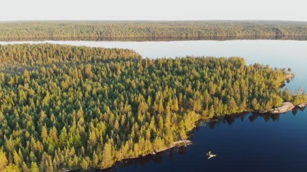 KARELIA,RUSSIA - SUMMER 2019: drone aerial shot, zoom out the island seascape from above — 비디오