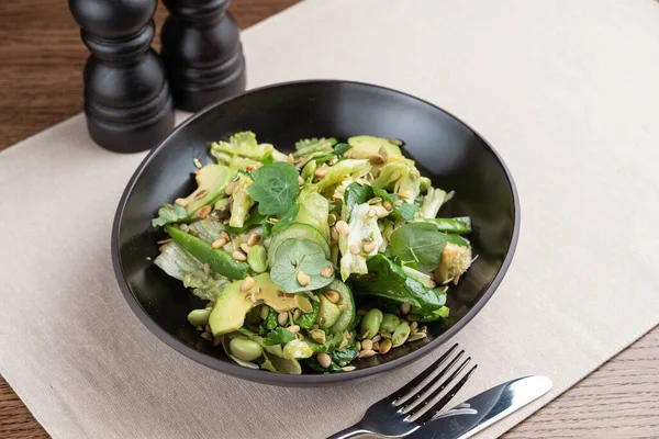 Green edamame salad with sprouts, avocado and cucumber