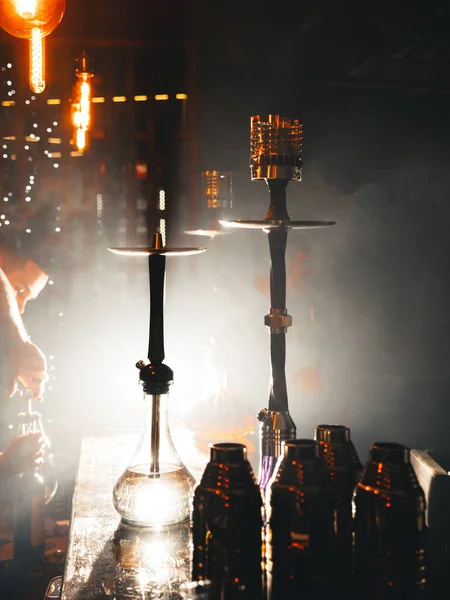 Row of different hookahs in a staff-room in a dramatic light