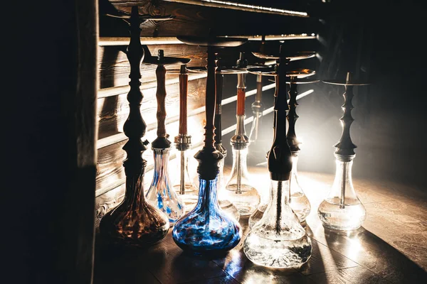 Row of different hookahs in a staff-room in a dramatic light