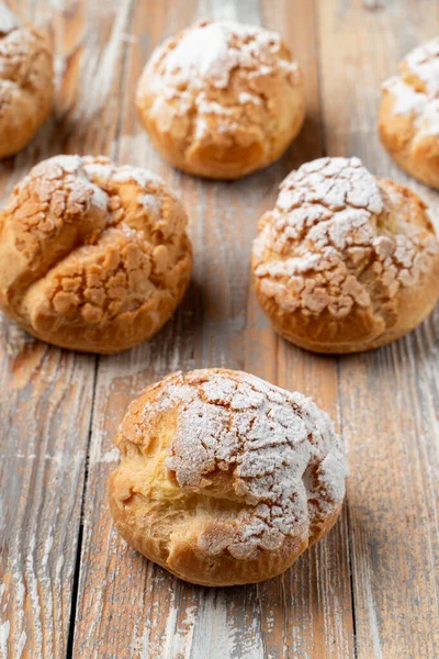 Close Golden Crust Profiterole Stuffed Buttercream Vintage Wooden Table — Stock Photo, Image