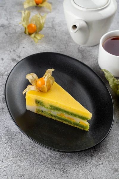 Tropical mango torte, birthday cake with mango souffle and a layer of kiwi jam