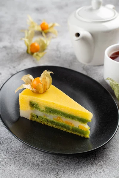 Tropical mango torte, birthday cake with mango souffle and a layer of kiwi jam