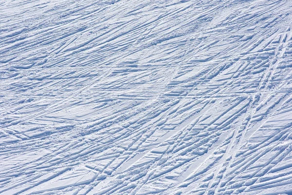 Lots of ski tracks in the fresh snow. Winter sports backgroun