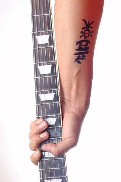 Kanji tatto - Kanji ordet för musik på handled — Stockfoto