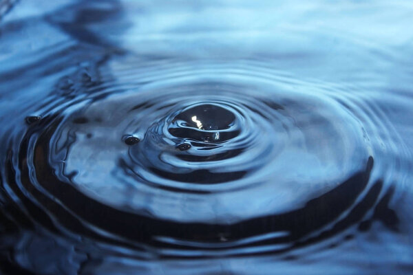 Water drop impact on water surface