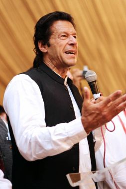 Tehreek-e-insaf chairman Imran Khan speaknig on mic clipart