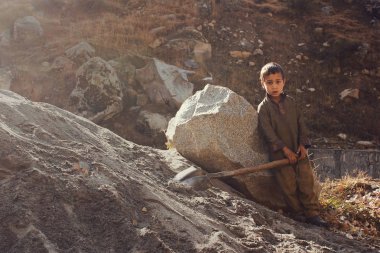 Child Labor - Little kid is working in swat valley clipart