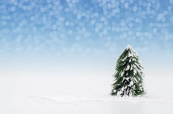 Christmas tree with lights snow winter background. — Stock Photo, Image