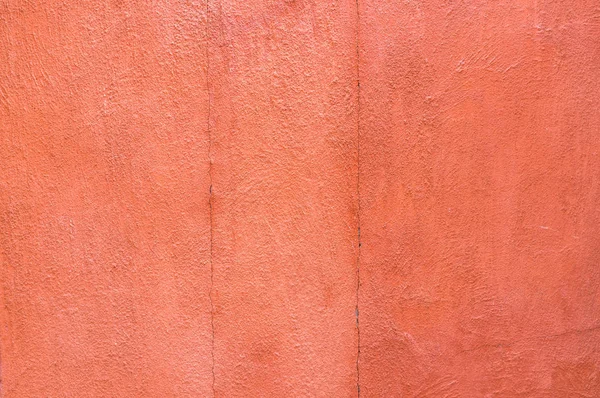 Close-up orange color concrete wall background. texture backgrou