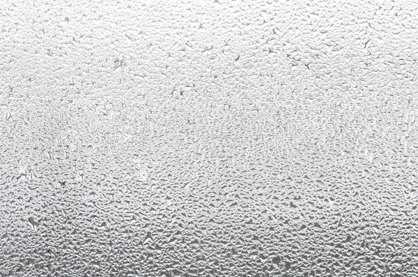 Water drops on glass window. Condensation on the window.