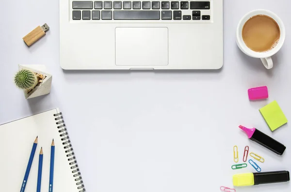 Computer laptop with blank notebook, cup of coffee, cactus, penc