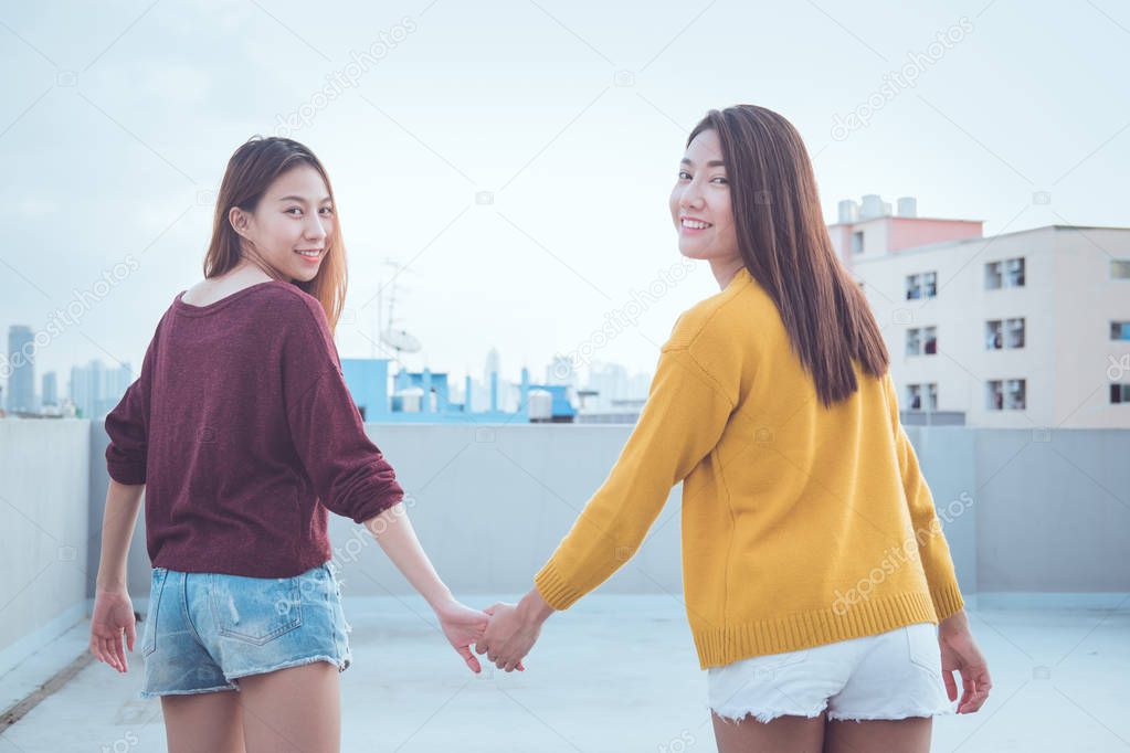 Lesbian couple together concept. Couple of young asian women wal