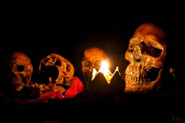 Skull and candle with candlestick on wooden background, still life concept — Stock Photo, Image