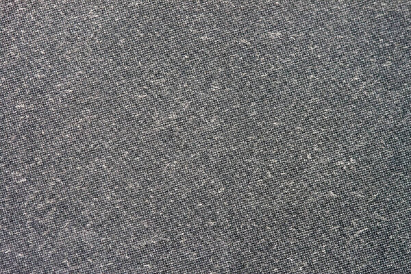 Texture of organic dark grey paper for artwork with numerous natural inclusions. Modern dark background, backdrop, substrate, composition use with copy space