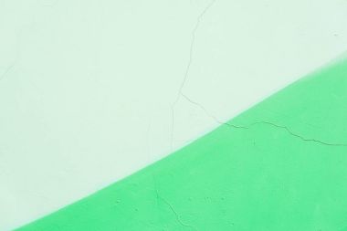 Grunge doku arka plan, yeşil renk tonlarını soyut. Ayrıntı kırık eski sıva duvar, parça grafiti, eski yontma boya, çizik. Zemin için