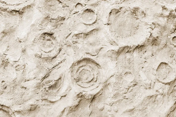 Zbliżenie: ostry kamień betonowa ściana tekstur, podobne do powierzchni Księżyca. Na tle nowoczesnych wzór, tapety lub projekt transparent — Zdjęcie stockowe