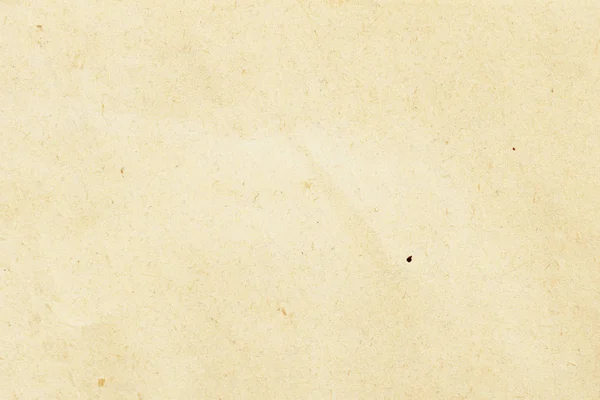 Textura de papel beige ecológico, fondo para diseño con texto o imagen de espacio de copia. Material reciclable, tiene pequeñas inclusiones de celulosa — Foto de Stock