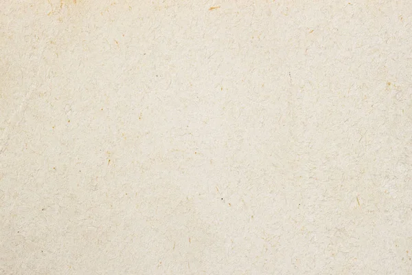 Textura de papel crema ecológico claro, fondo para el diseño con texto o imagen de espacio de copia. Material reciclable, tiene pequeñas inclusiones de celulosa —  Fotos de Stock