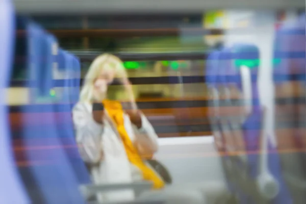 Abstract Defocused Image Unrecognizable Silhouettes Young Women Sitting Train Window — Stock Photo, Image