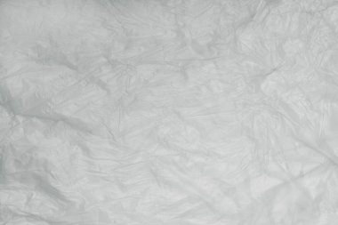 Işığın soyut dokusu buruşmuş polietilen, geri dönüşüm için plastik, ekoloji konsepti, çevre kirliliği