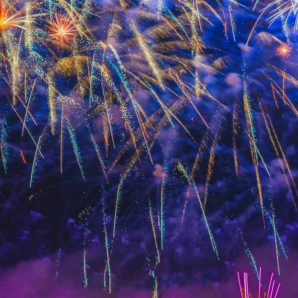 Picturesque sky in colorful sparks of festive fireworks, colored smoke and bright nebula, holiday background — Stock Photo, Image