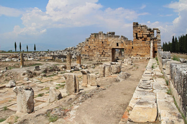 The ruins of the ancient Hierapolis city next to the travertine pools of Pamukkale, Turkey.