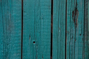 Yeşile boyanmış eski bir çitin ahşap dokusu. Pis, kuru..