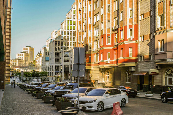 Central business area in Dnipro city, Ukraine. City landscape and transportation. Car at a parking zone